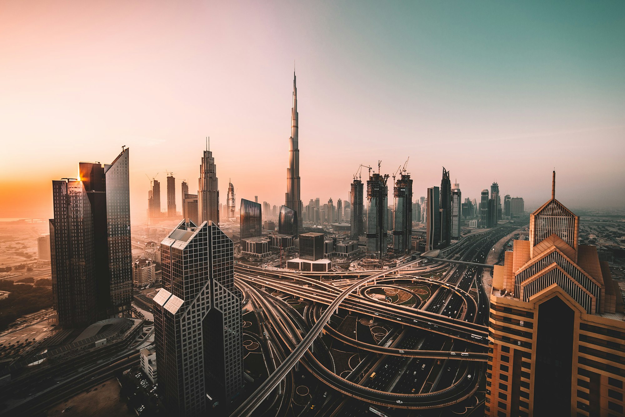 Arabian desert city skyline at sunset